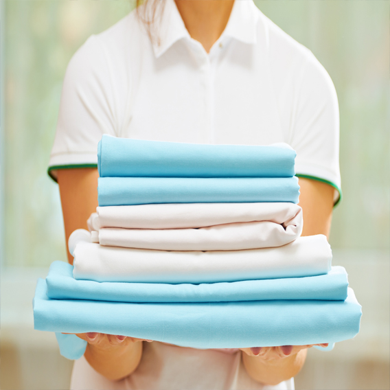 Freshly ironed shirts on hangers ready for collection across Northwich
